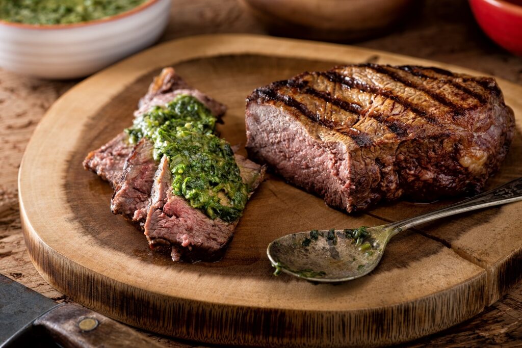 Plate of Argentinian steak with chimichurri sauce