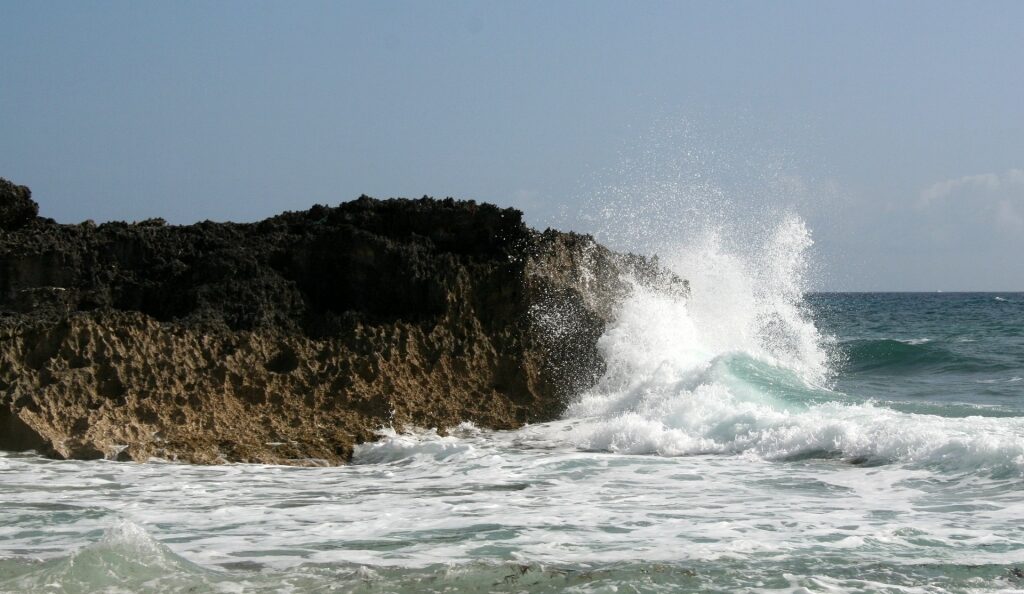 Large waves against rocky shore in Surfer’s Beach