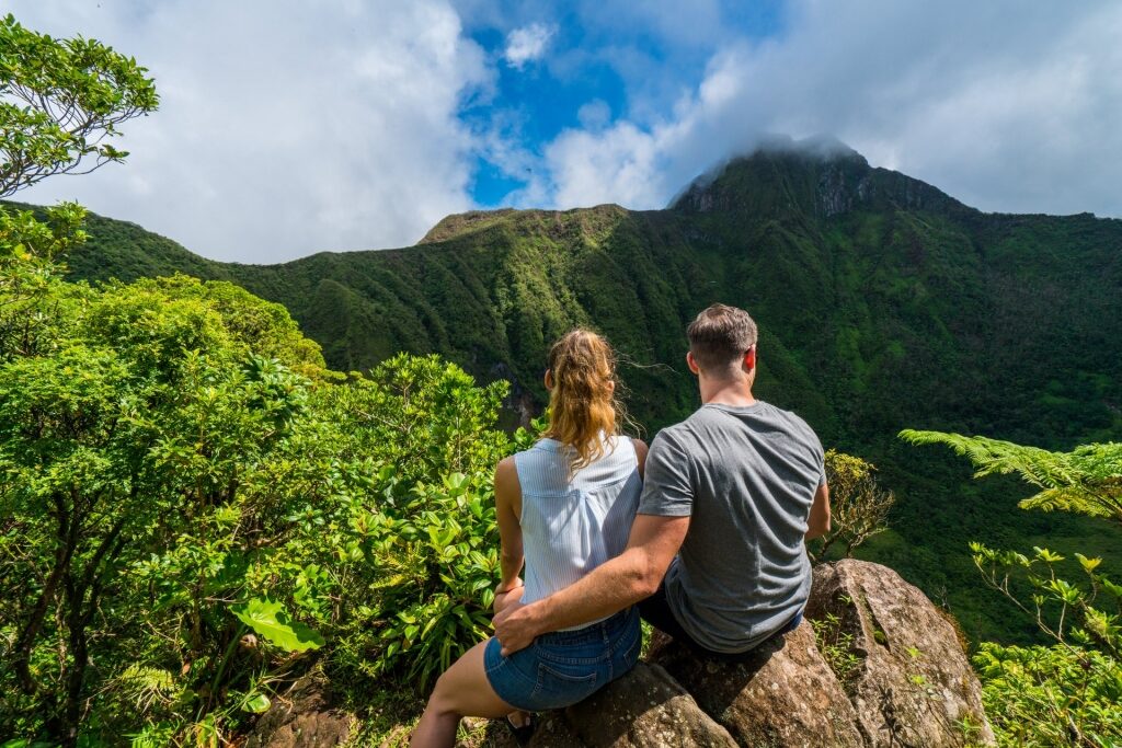 Couple looking at the lush scenery of Mount Liamuiga