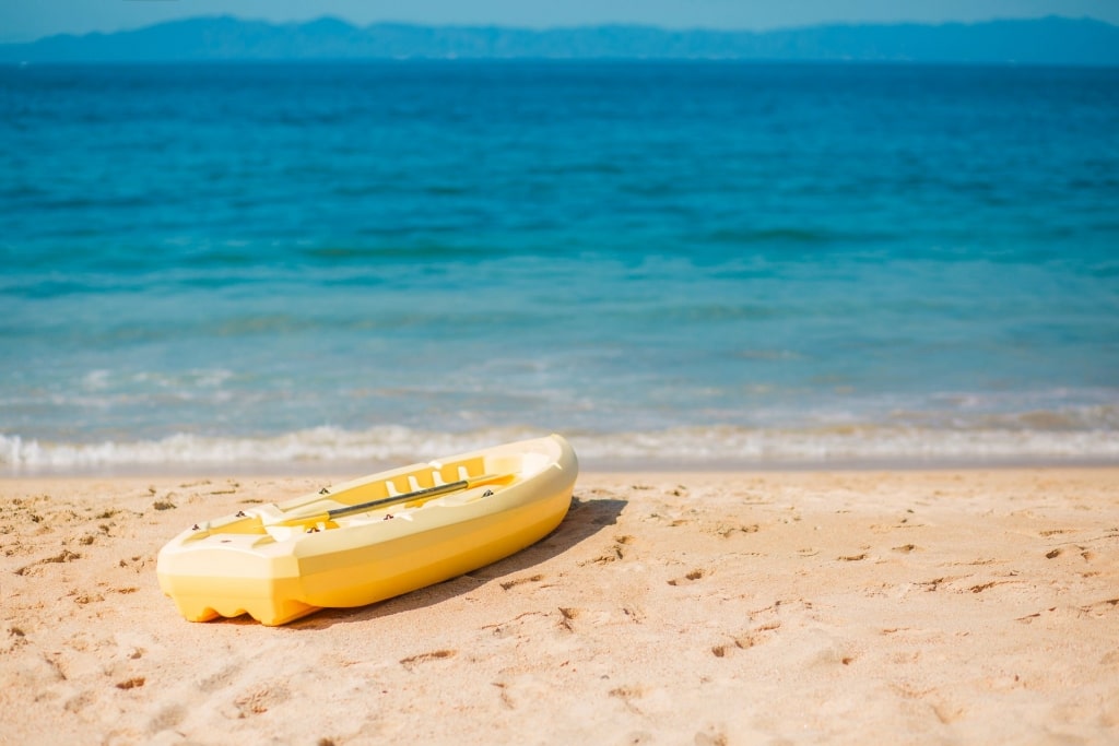 Soft sands of Playa de Oro with kayak boat