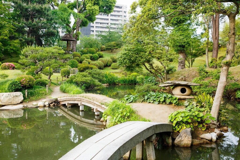 Lush landscape of Shukkeien Garden with koi ponds and bridges