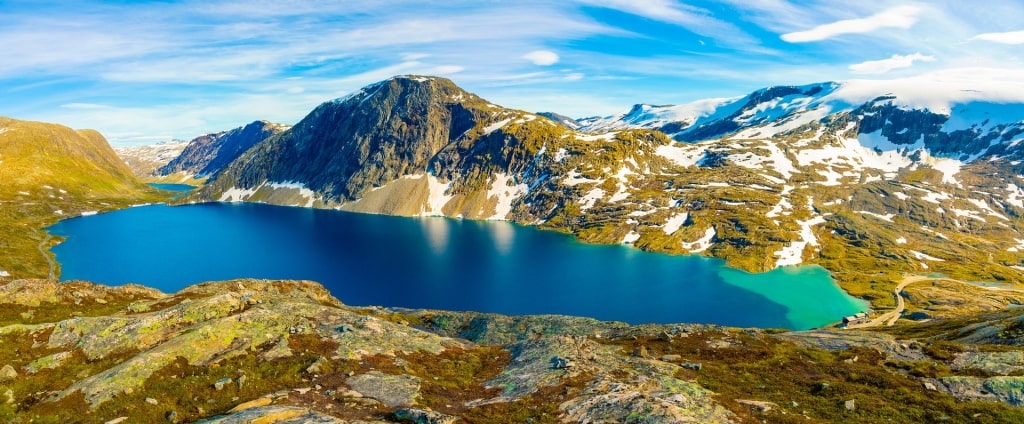 Lake Djupvatnet surrounded by snow-capped mountains