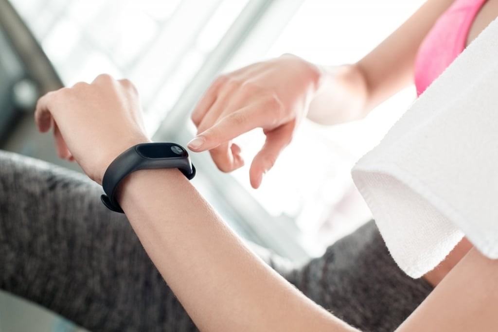 Woman wearing an activity tracker