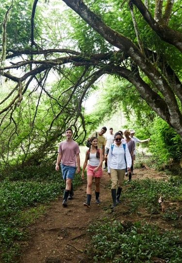 People walking in The Ranch Galapagos with kids