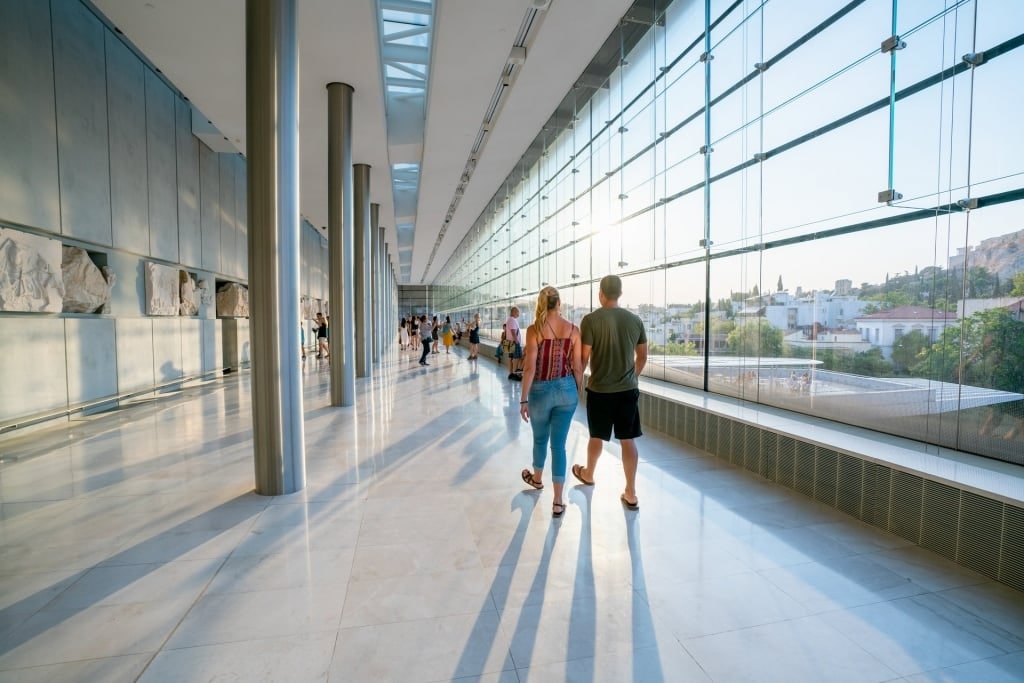 Couple exploring the Acropolis Museum