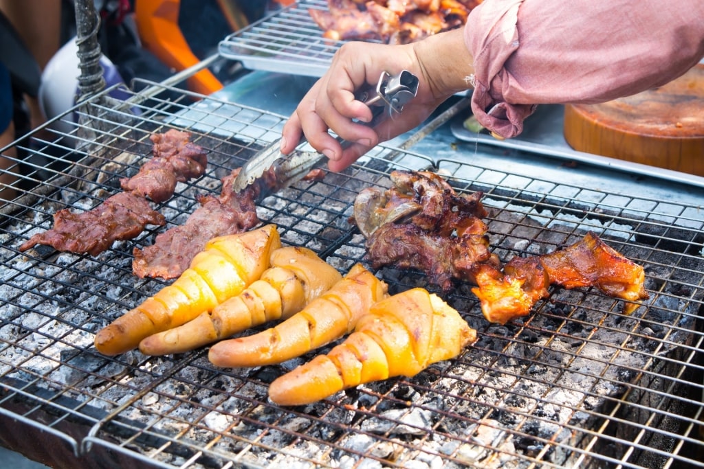 Man grilling pigtails