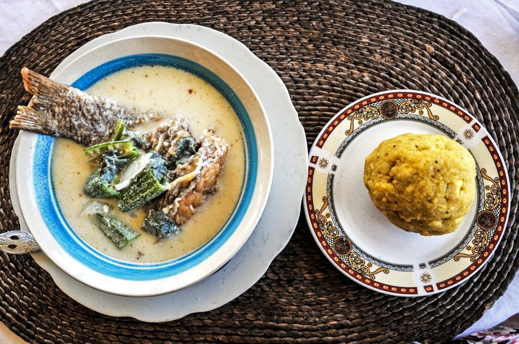 Plate of coconut-fish soup and spiced banana and plantain mashes