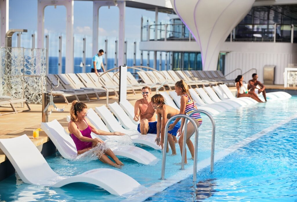 Family by the pool aboard Celebrity Edge