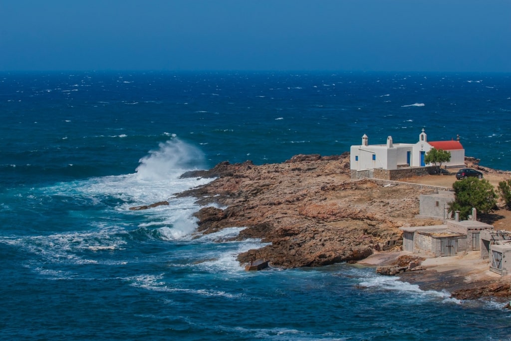 Large waves crashing onto Merchia Beach