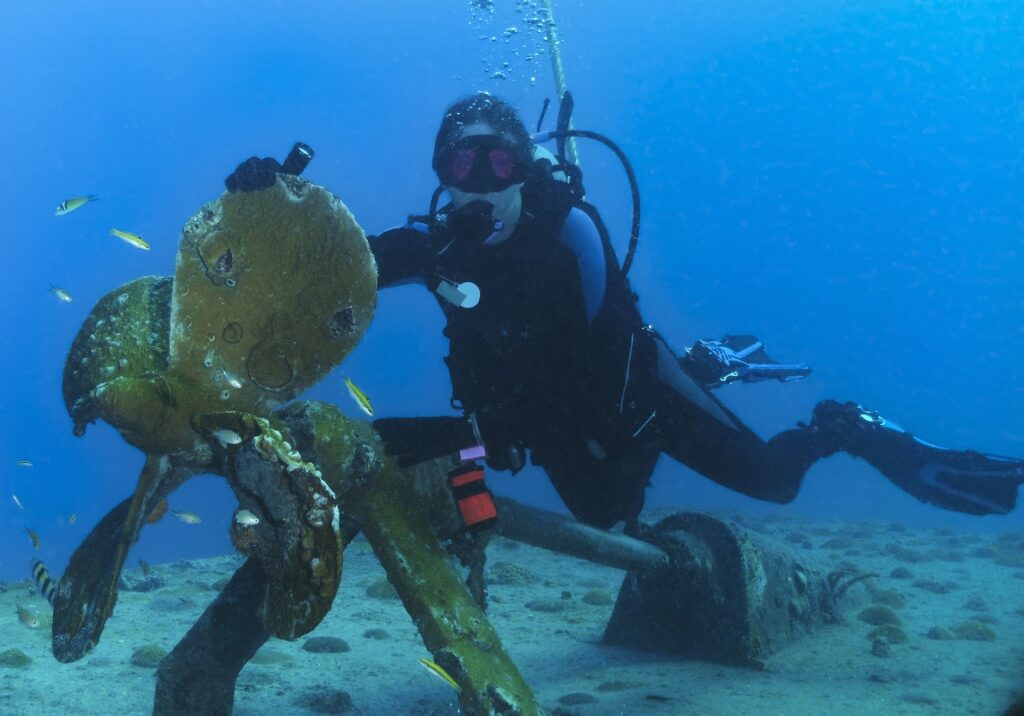 Woman scuba diving in the Gregory Wreck
