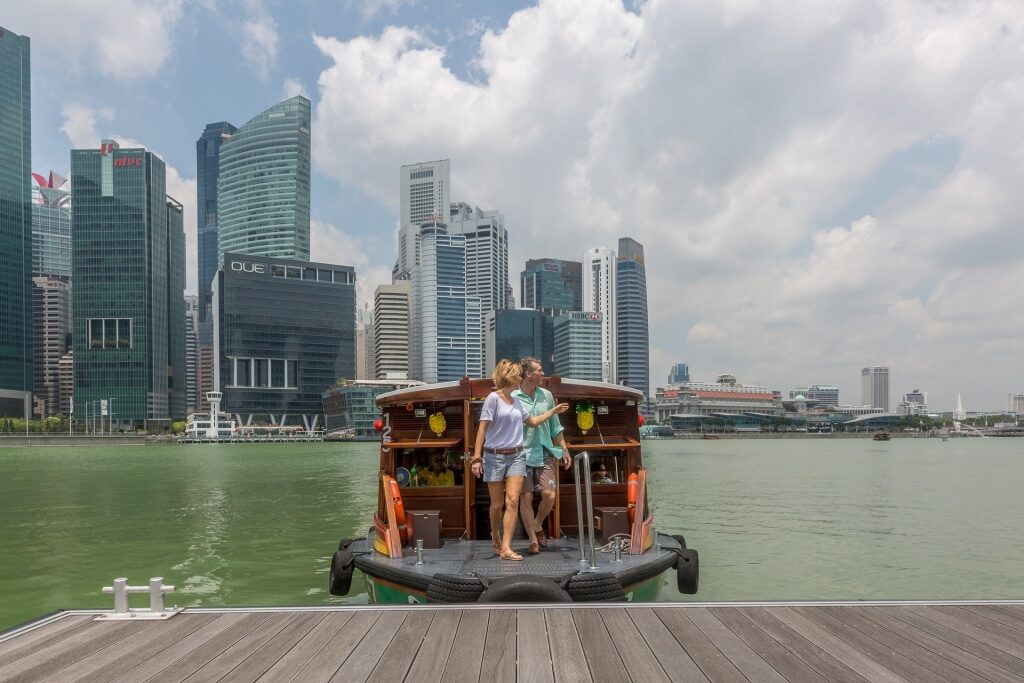 Couple on a bumboat cruise in Singapore