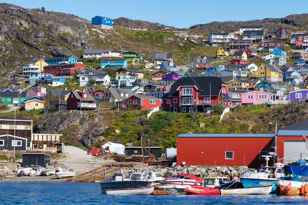 Colorful houses in Qaqortoq with view of the water