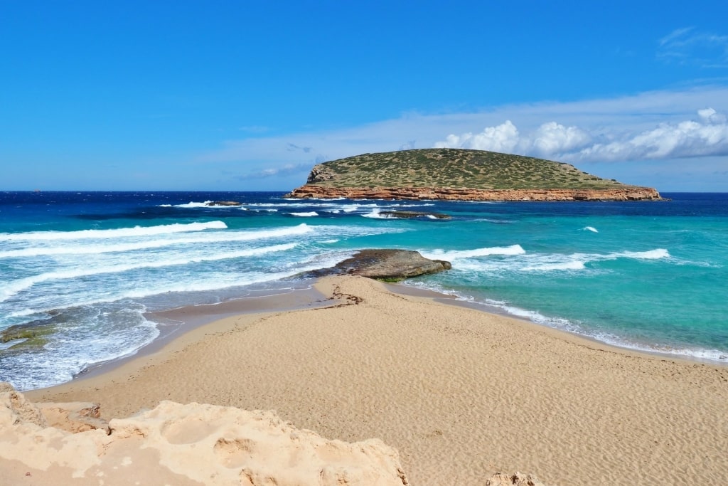 Aquamarine water of Cala Conta Beach