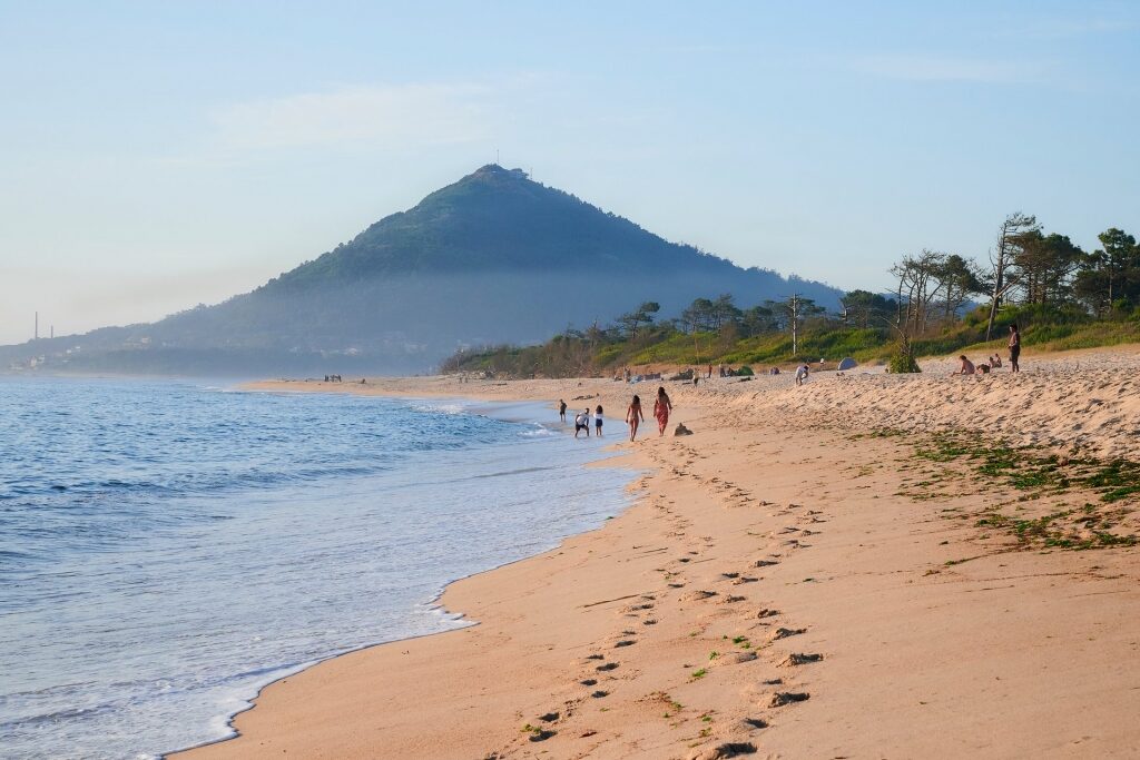 Peaceful beach of Praia de Moledo with view of the mountain