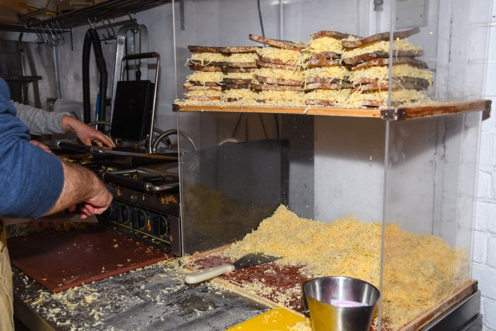 Man preparing food at the Borough Market in London, England