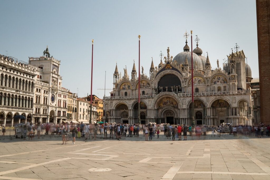 People sightseeing along St. Mark's Basilica, Venice