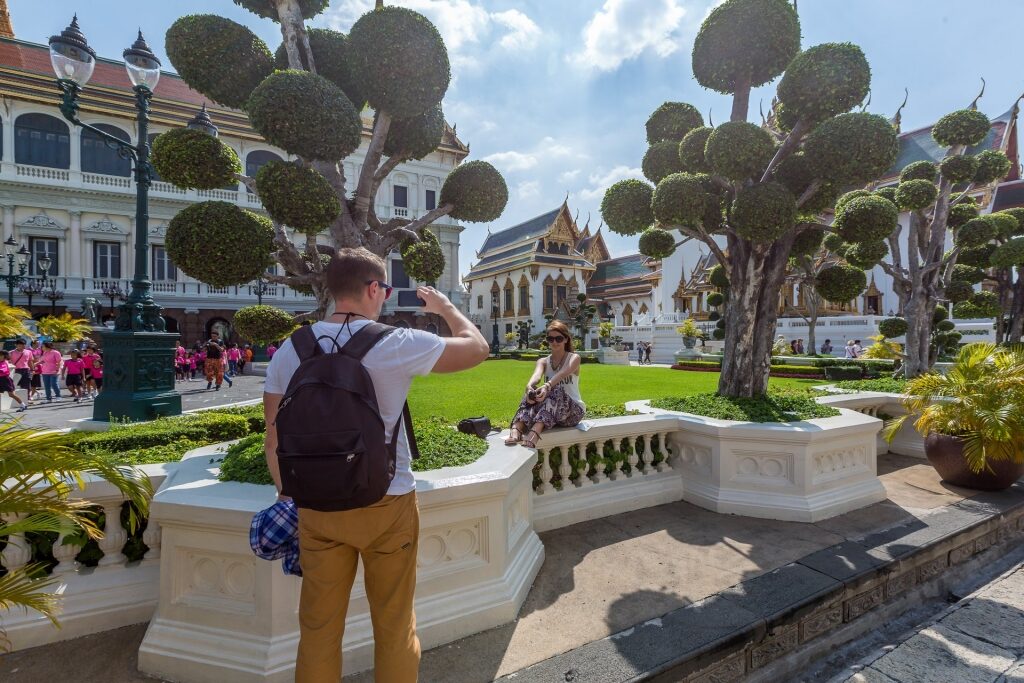 Tourists taking a picture inside the Grand Palace