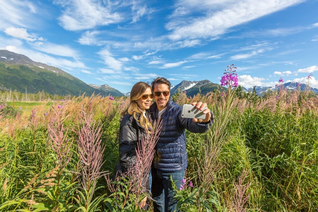 Couple taking a picture in Alaska