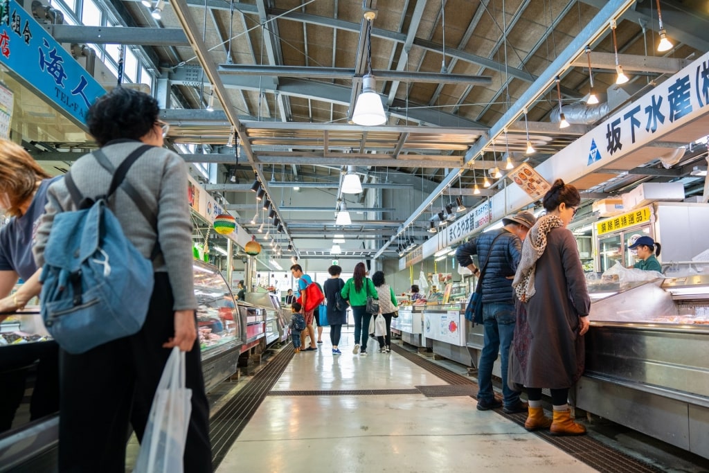 People shopping inside a fish market in Okinawa