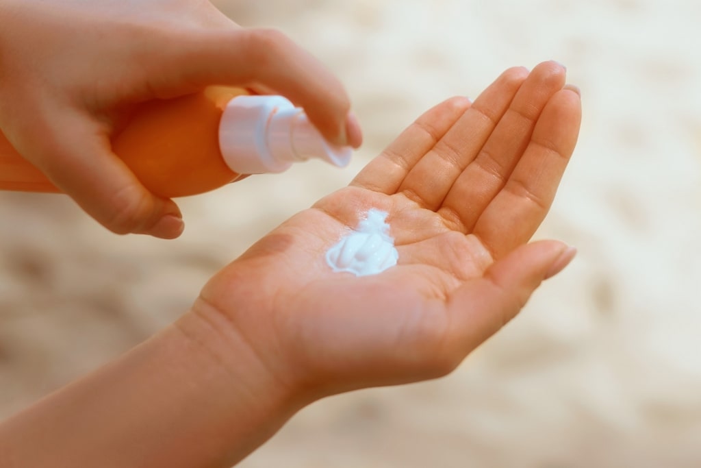 Person applying sunscreen