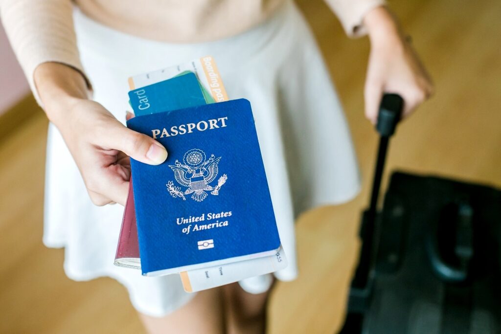Woman holding a USA passport