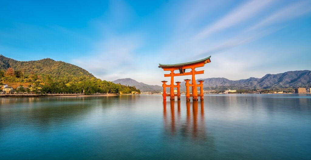Beautiful Itsukushima Shrine with bright orange torri