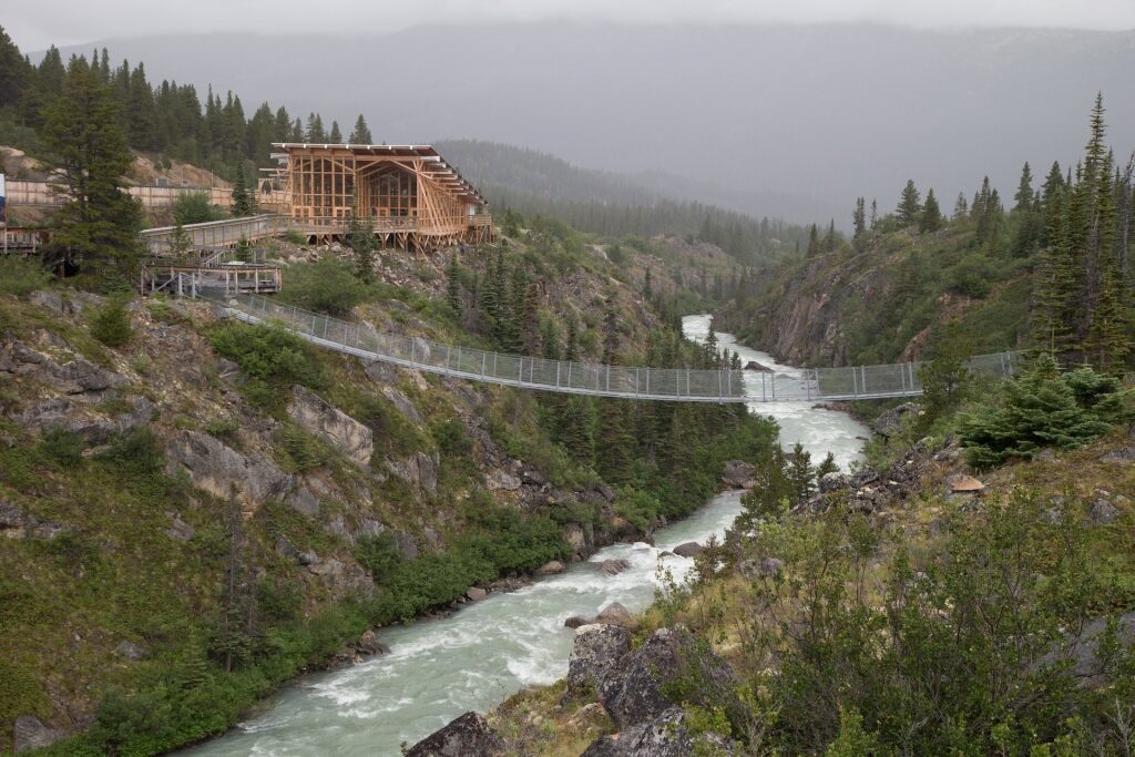 View of Yukon Suspension Bridge with cascading river