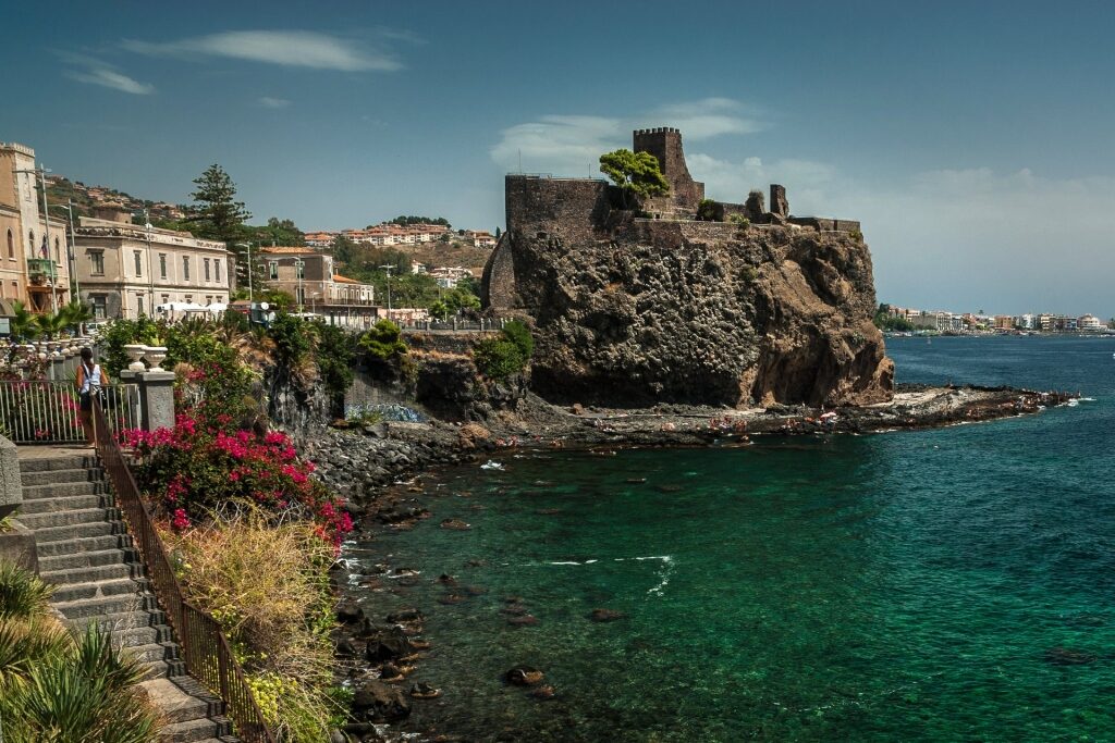 View of the historic Norman Castle in the nearby town of Aci Castello