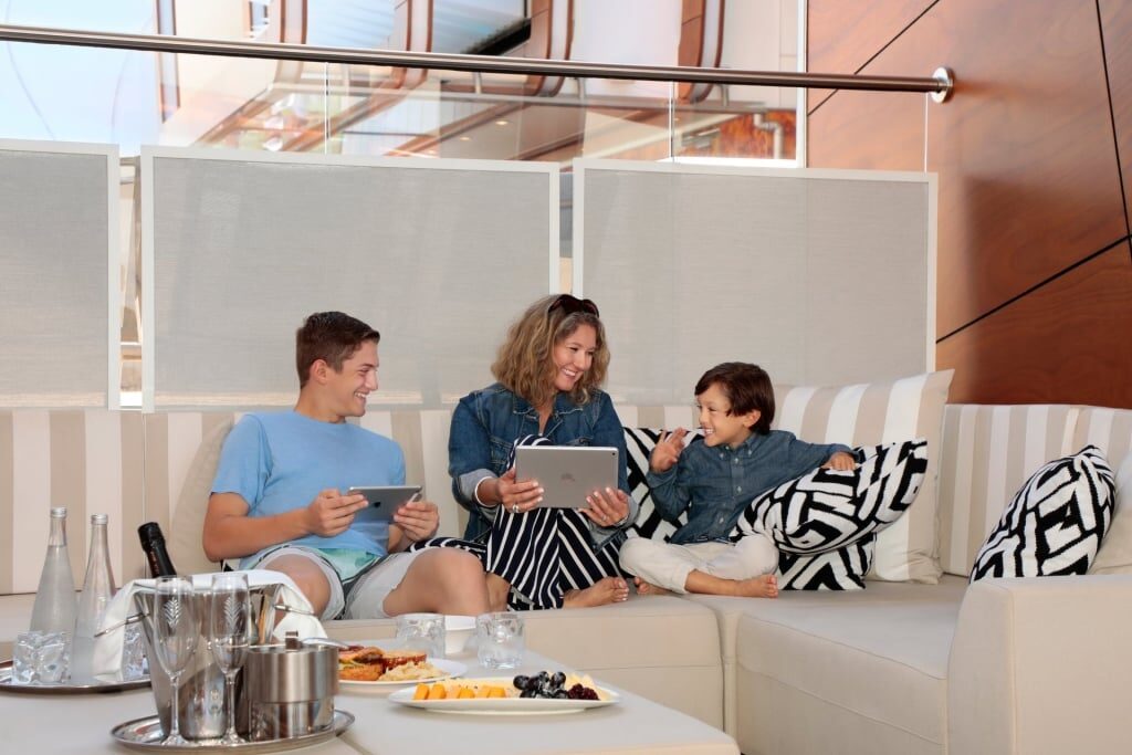 Family using tablets while on a cruise