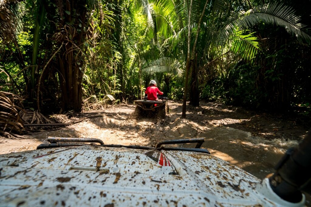 People on an ATV ride at the Jungle Paw Outpost camp