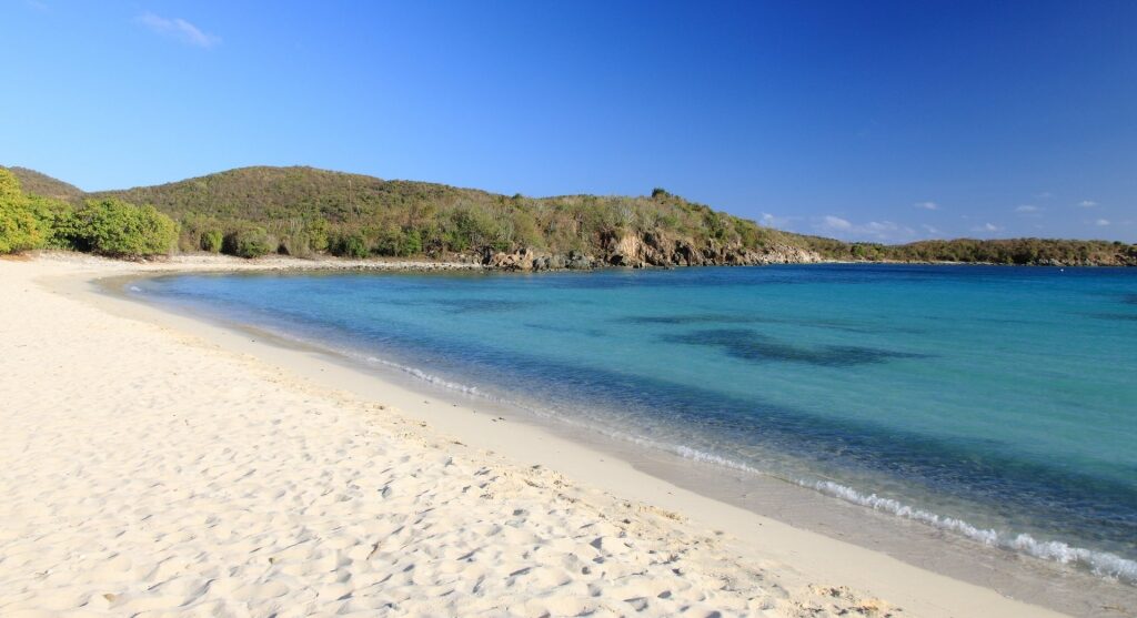 Sandy shoreline of Honeymoon Beach