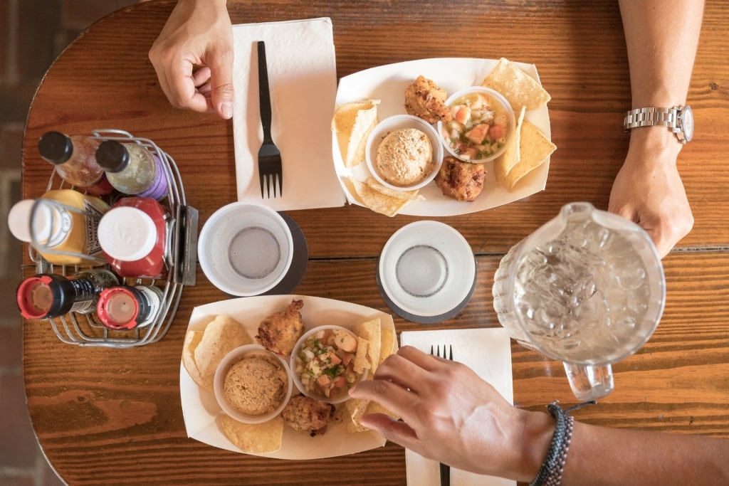 People eating conch fritters