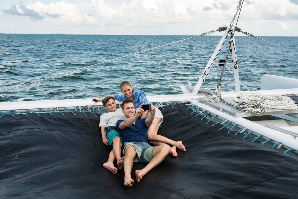 Family on a catamaran in Grand Cayman