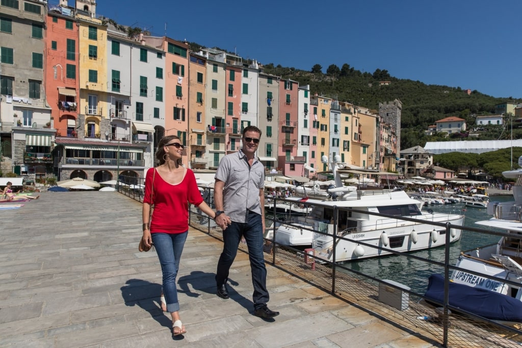 Couple walking around Portovenere harbor