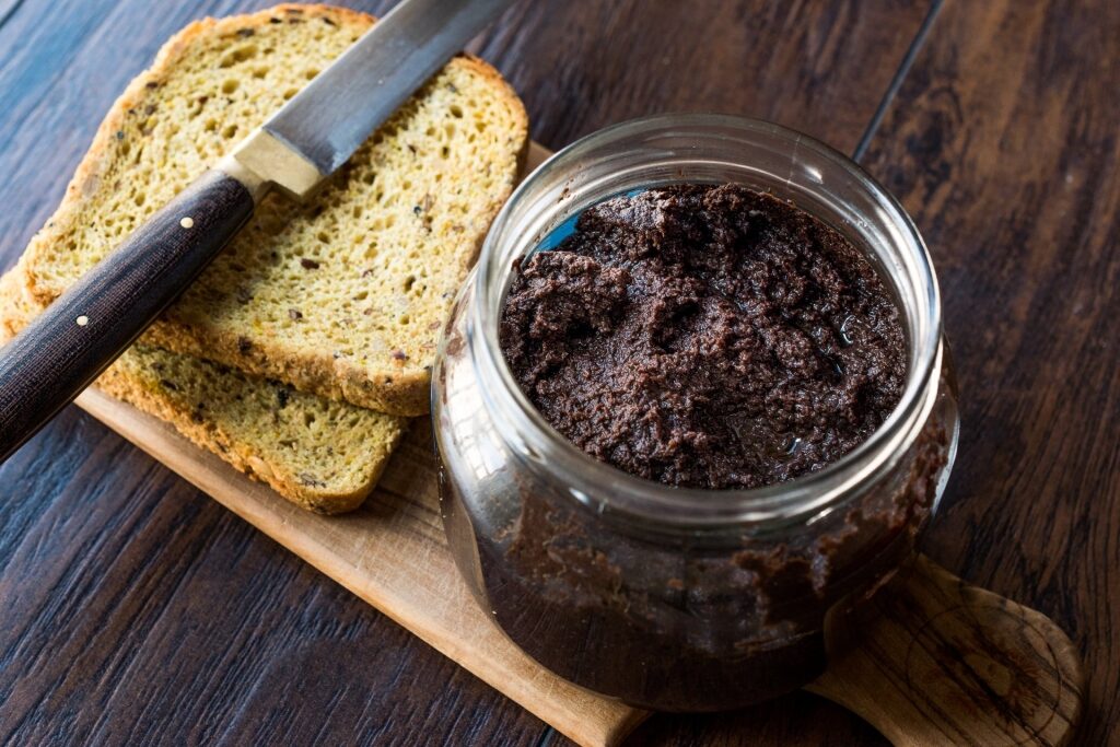 Glass of tapenade with bread