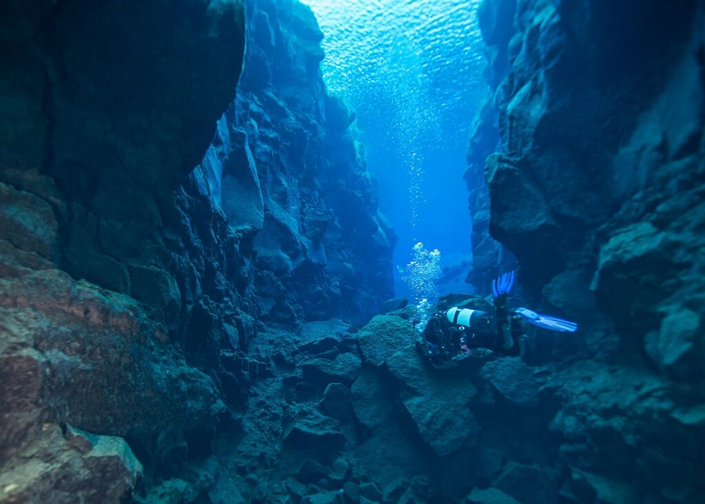 Diver in Silfra Fissure, one of the best diving spots in the world