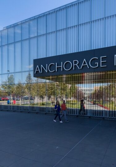 Couple walking along Anchorage Museum