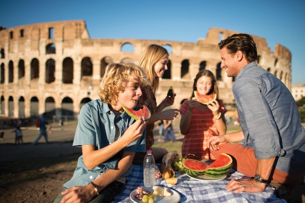 Family eating near the Colosseum in Rome