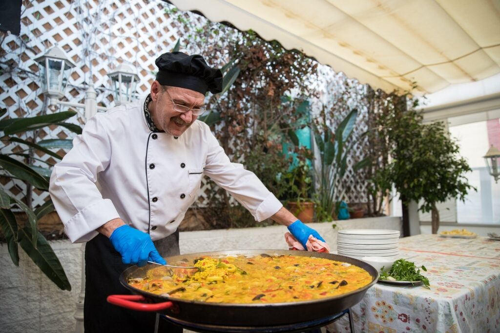 Chef cooking paella