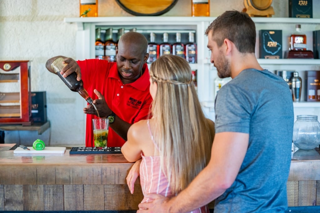 Couple trying rum at the Mount Gay Rum Distillery