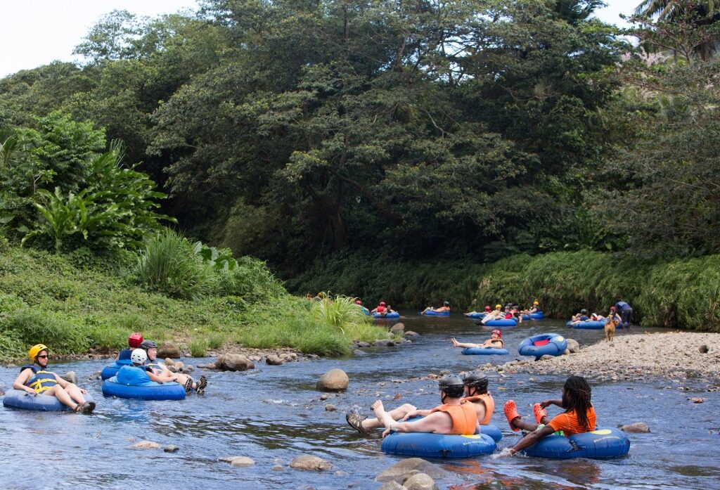 People on a river tubing adventure in Dominica