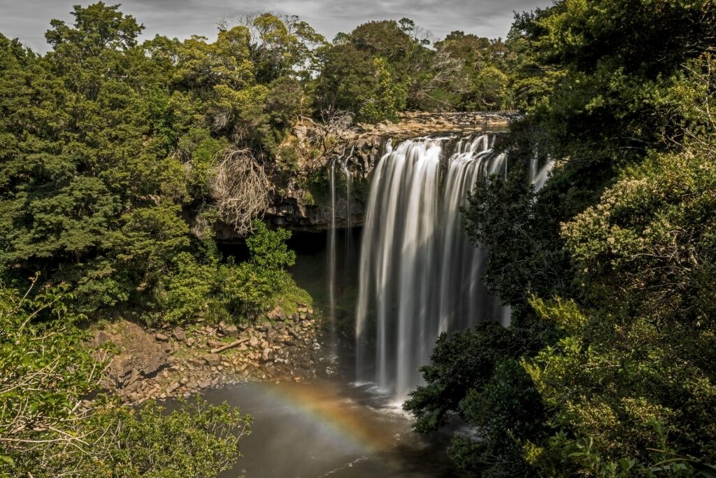 Iconic Rainbow Falls with lush landscape 