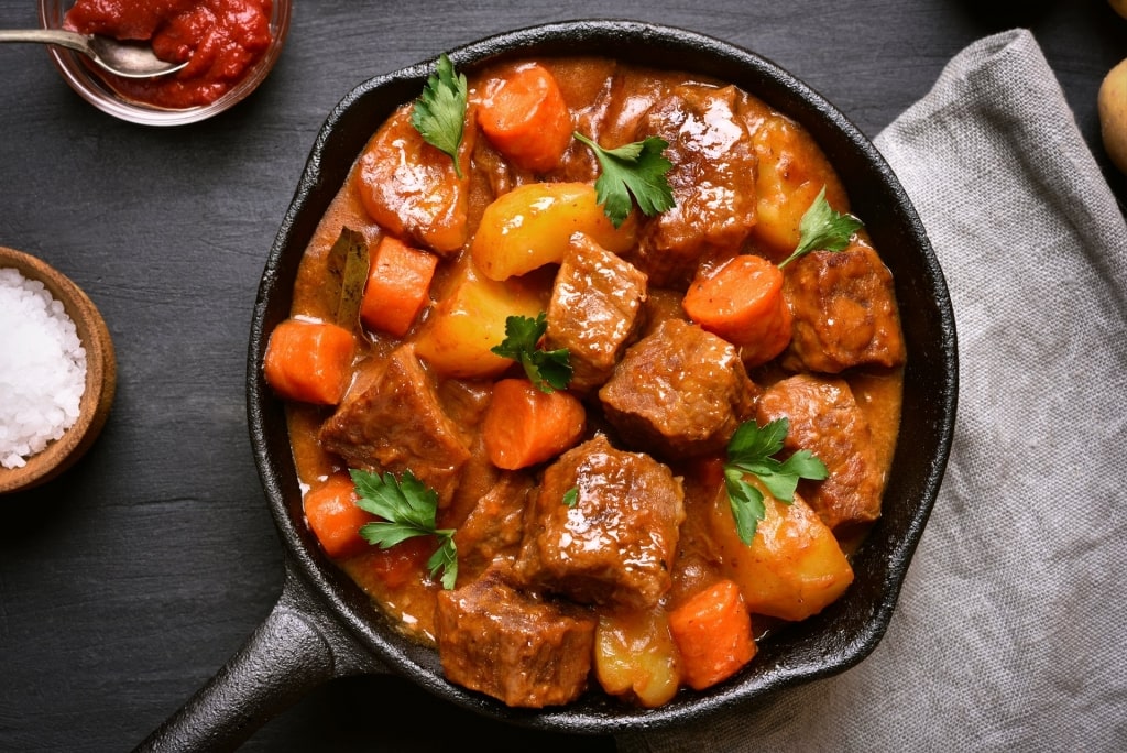 Hearty bowl of Stoba, one of the best Aruba food