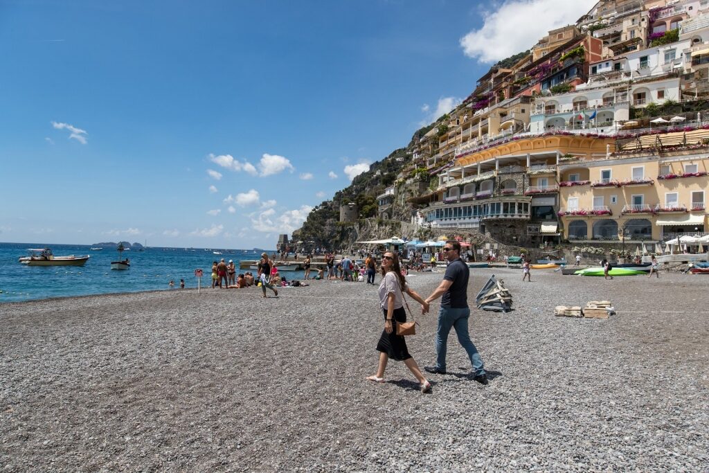 Couple walking to a beach in Naples