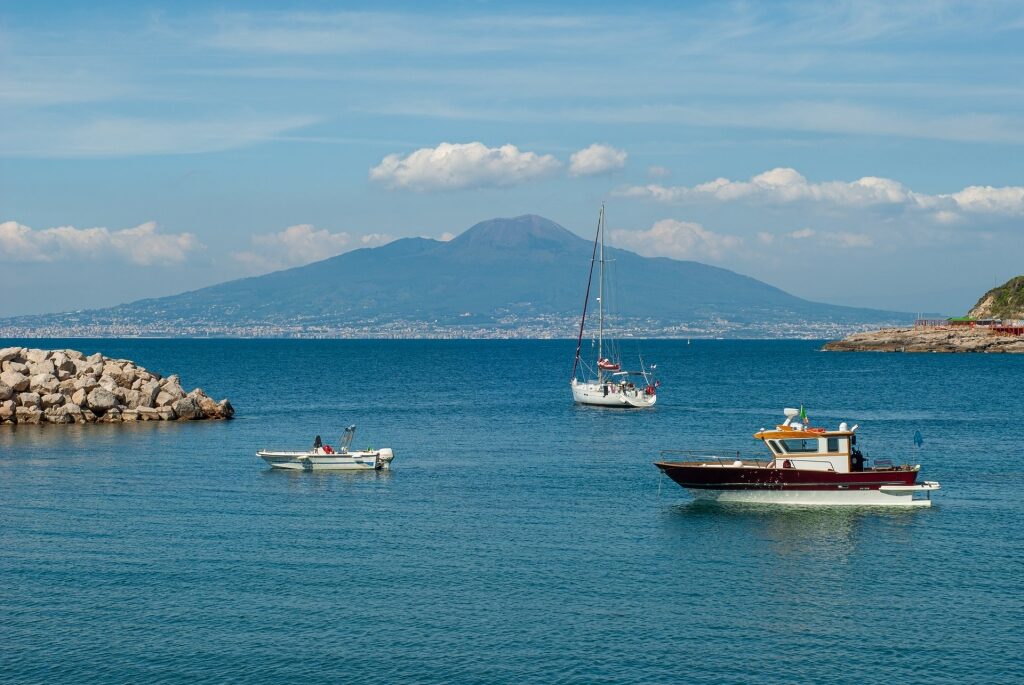 Boats along Marina di Puolo, Sorrento with view of the mountain