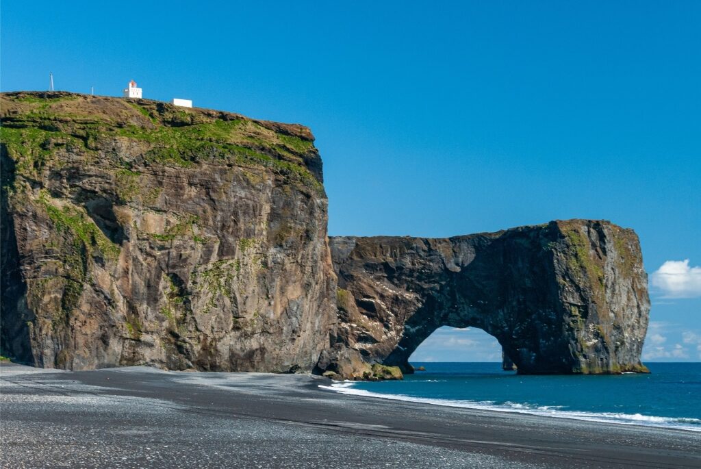 Black sands of Dyrhólaey Beach, Iceland with rock formations