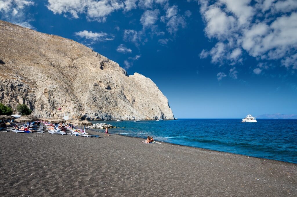 Black sands of Perissa Beach in Santorini, Greece