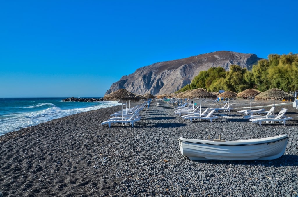 Long stretch of black sands of Kamari Beach, Santorini