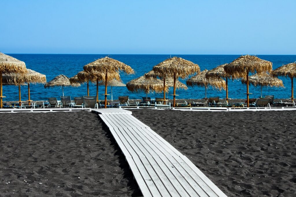 Amazing black sand of Perivolos Beach