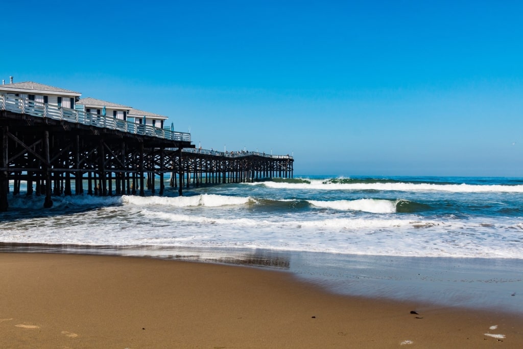 Brown sands of Pacific Beach with popular boardwalk